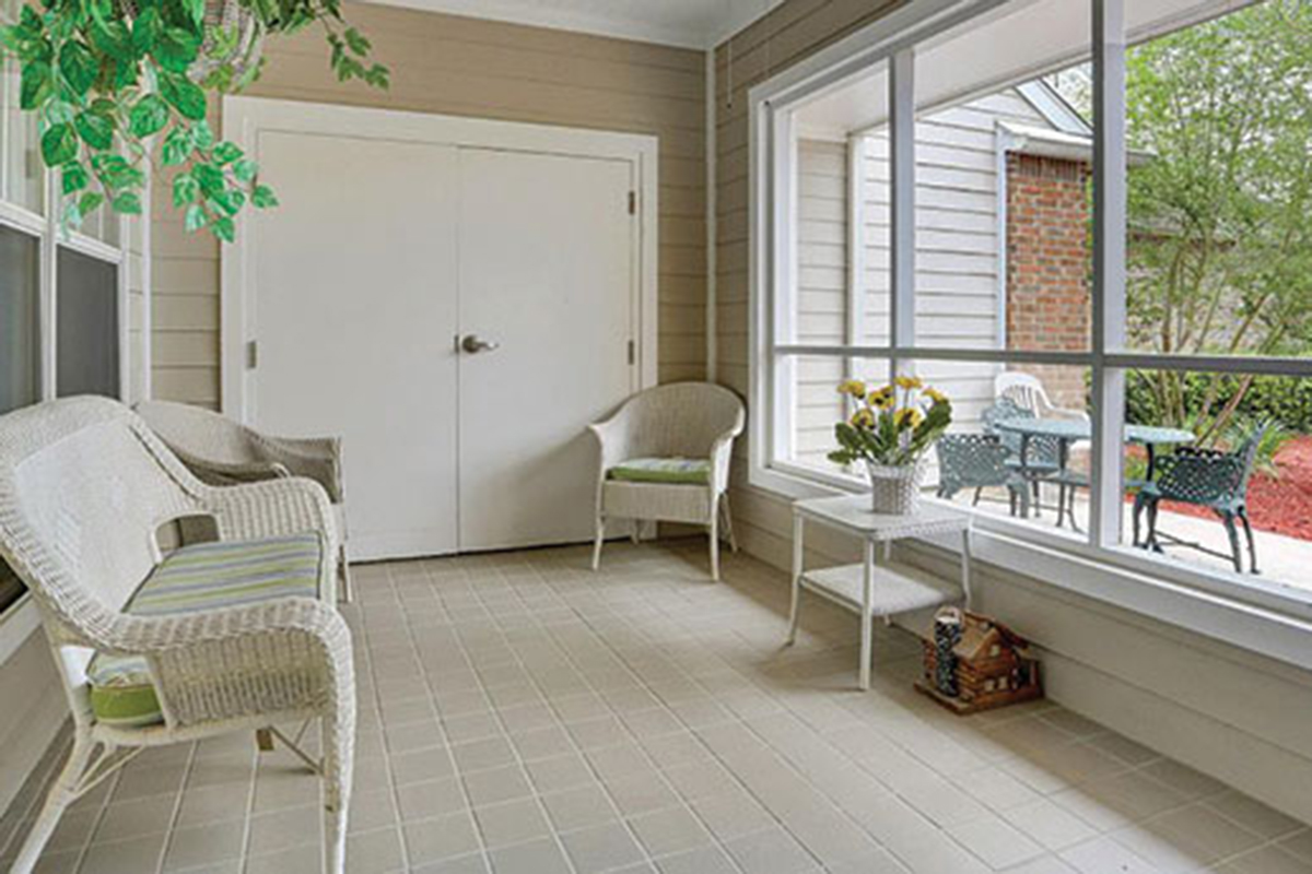 Enclosed patio with white furniture